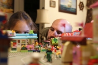 Annabelle Kurtz examines the toy city her father Carl Kurtz built for her in their home in Fort Worth, TX on Sept. 29, 2013. (TCU/Bethany Peterson)